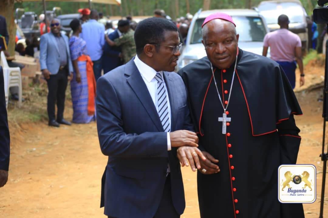 Katikkiro Mayiga welcoming Bishop Jjumba, who led the prayer service Katikkiro Mayiga welcoming Bishop Jjumba, who led the prayer service
